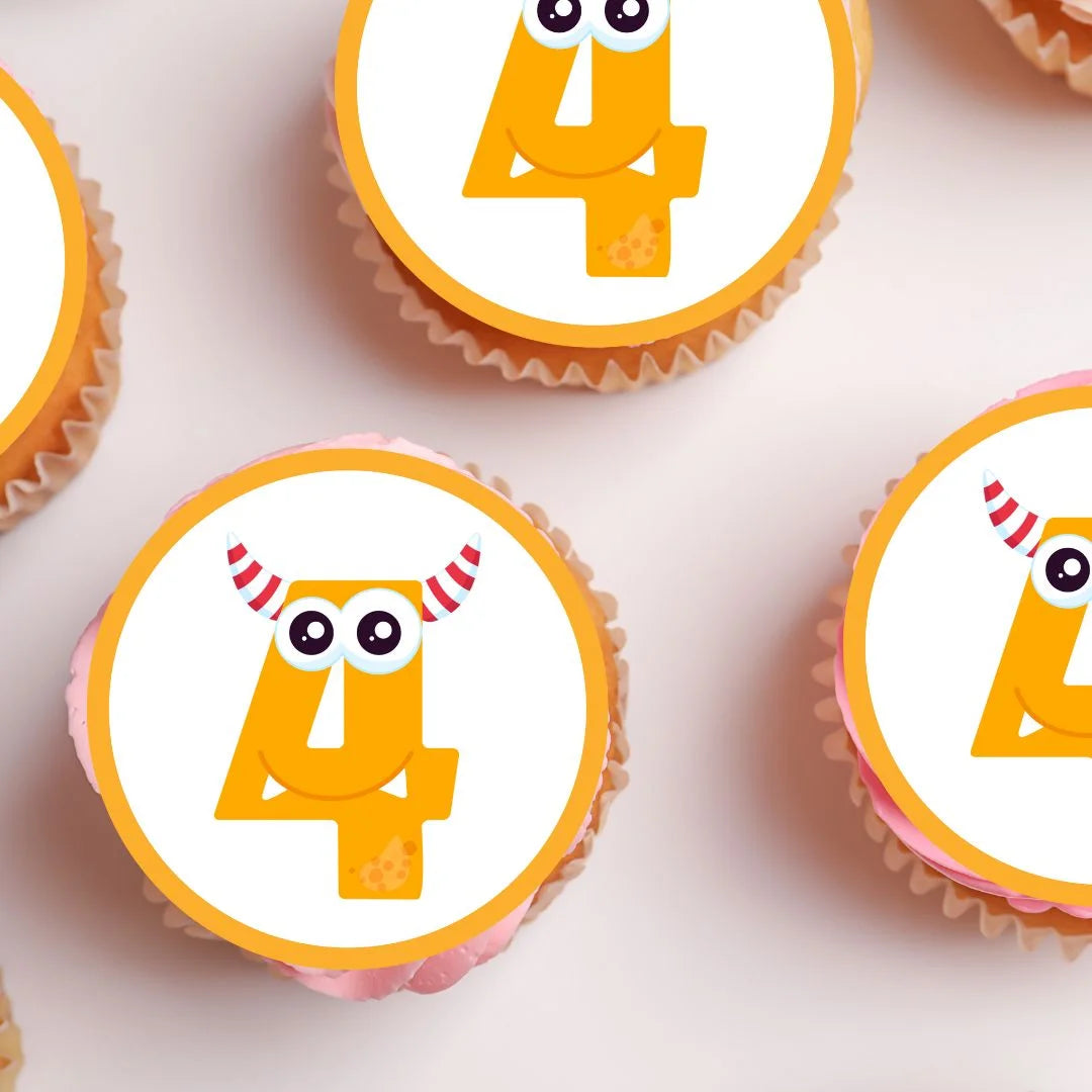 4th Birthday Monster Theme Edible Cupcake Toppers with orange number 4 on white iced cupcakes