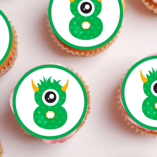 8th Birthday Monster Theme Edible Cupcake Toppers on white frosted cupcakes