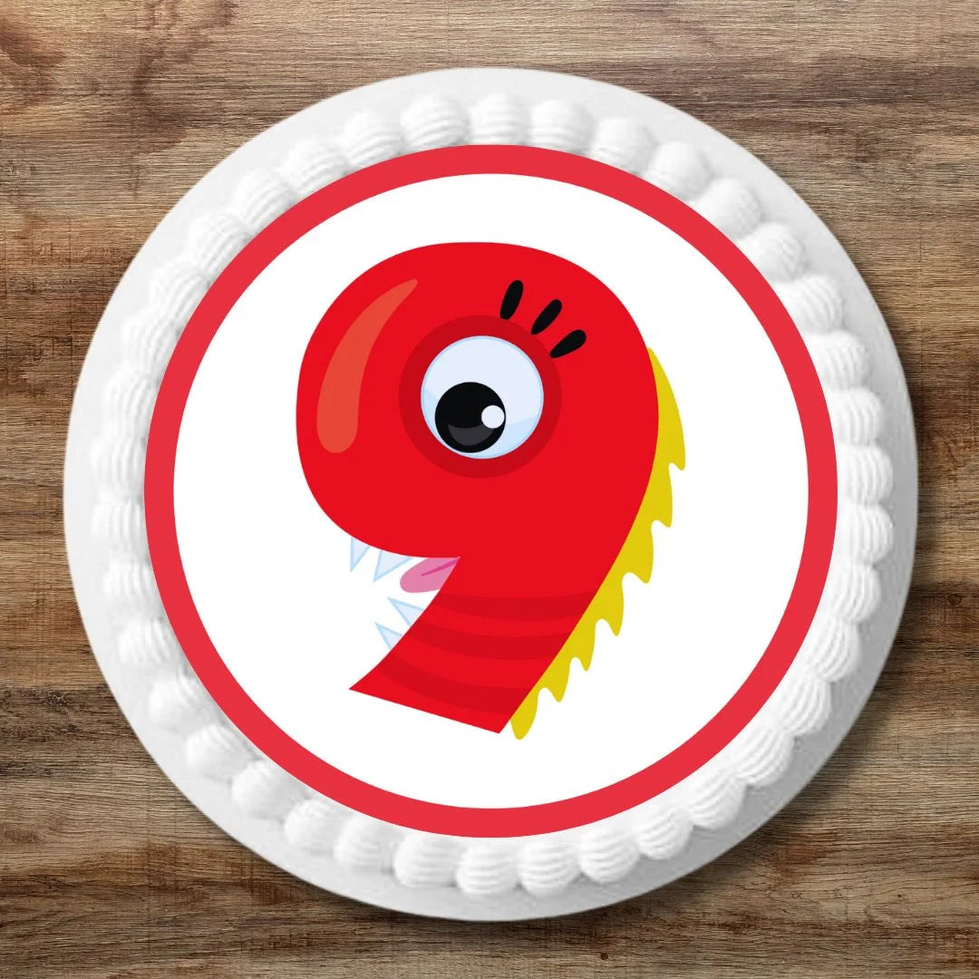 red number 9 moster theme cake topper on a white iced round cake 