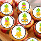 Pineapple Edible Cupcake Toppers on cupcakes with pink frosting