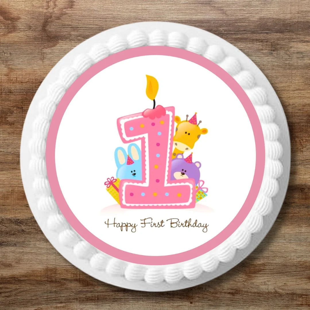 1st Birthday Pink Edible cake topper with illustrated animals characters and a pink 1. The topper is on on a white iced cake.