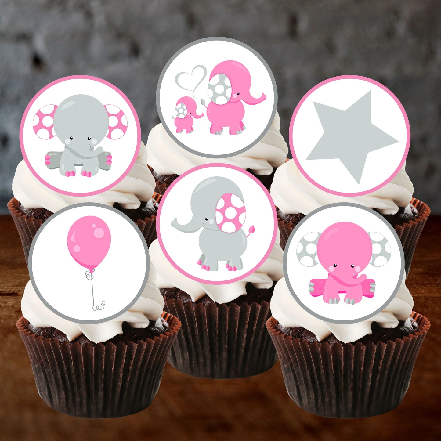 six chocolate frosted cupcakes with edible cake toppers featuring cute  pink elephants