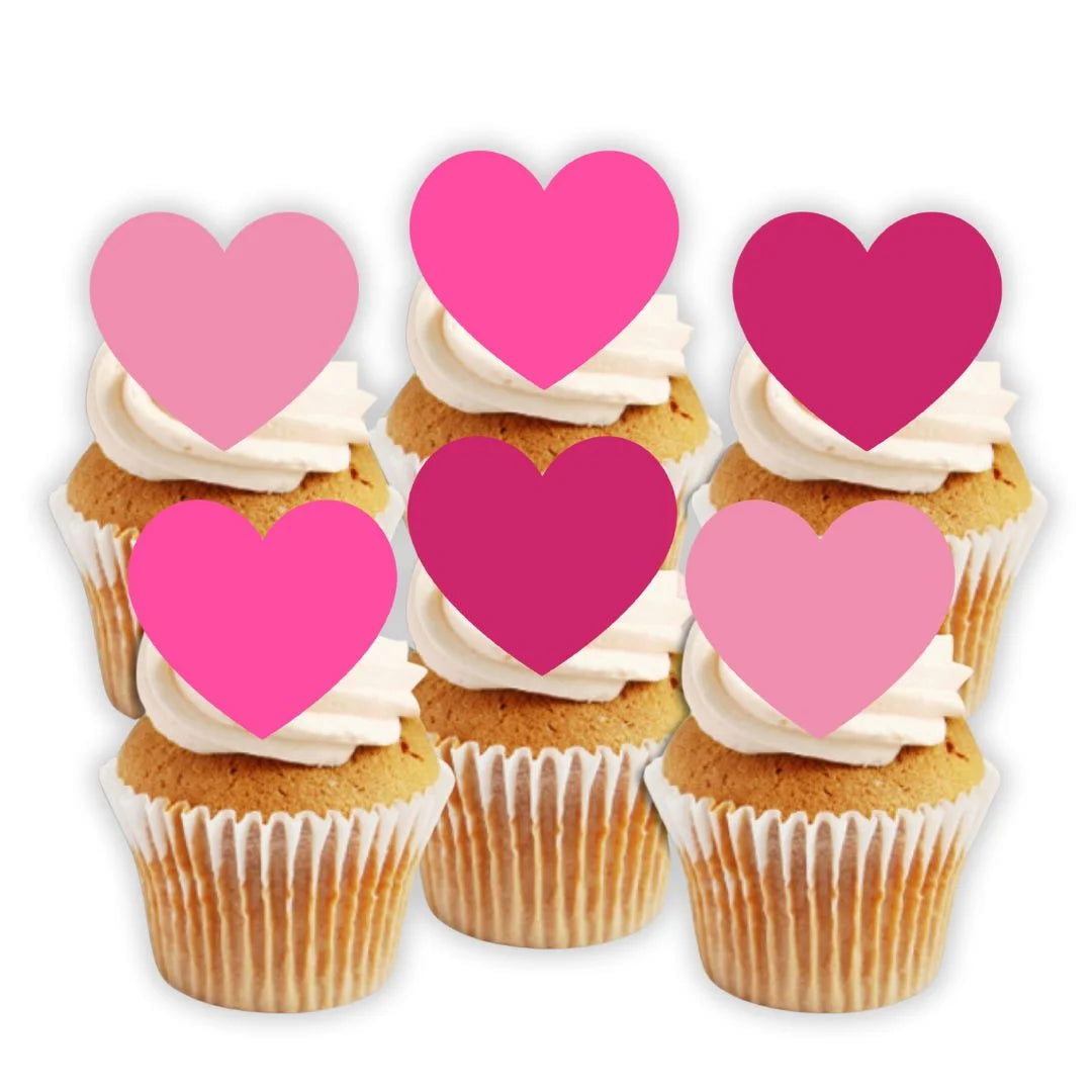 Pink Love Heart Edible Cupcake Toppers on white frosted cupcakes 