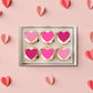 Pink Love Heart Edible Cupcake Toppers on white frosted cupcakes 