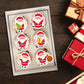 Cute Santa Edible Cupcake Toppers on white frosted cupcakes