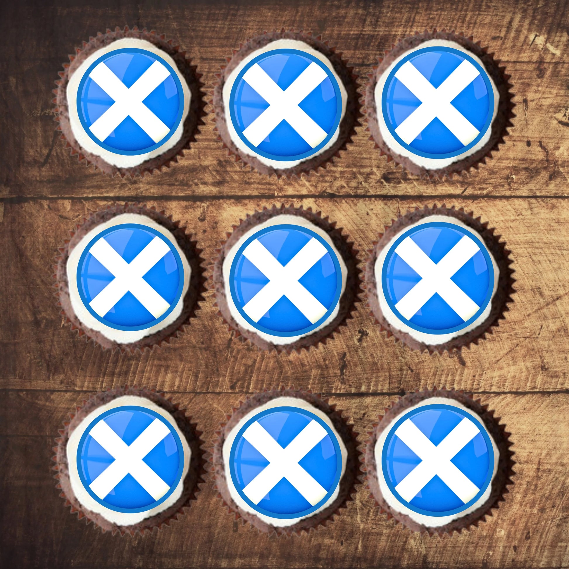 top view of Scottish Flag Edible Cupcake Toppers on chocolate cupcakes with white frosting 