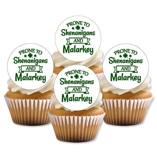 Cupcakes with white frosting and 'Prone to Shenanigans and Malarkey' toppers on a white background
