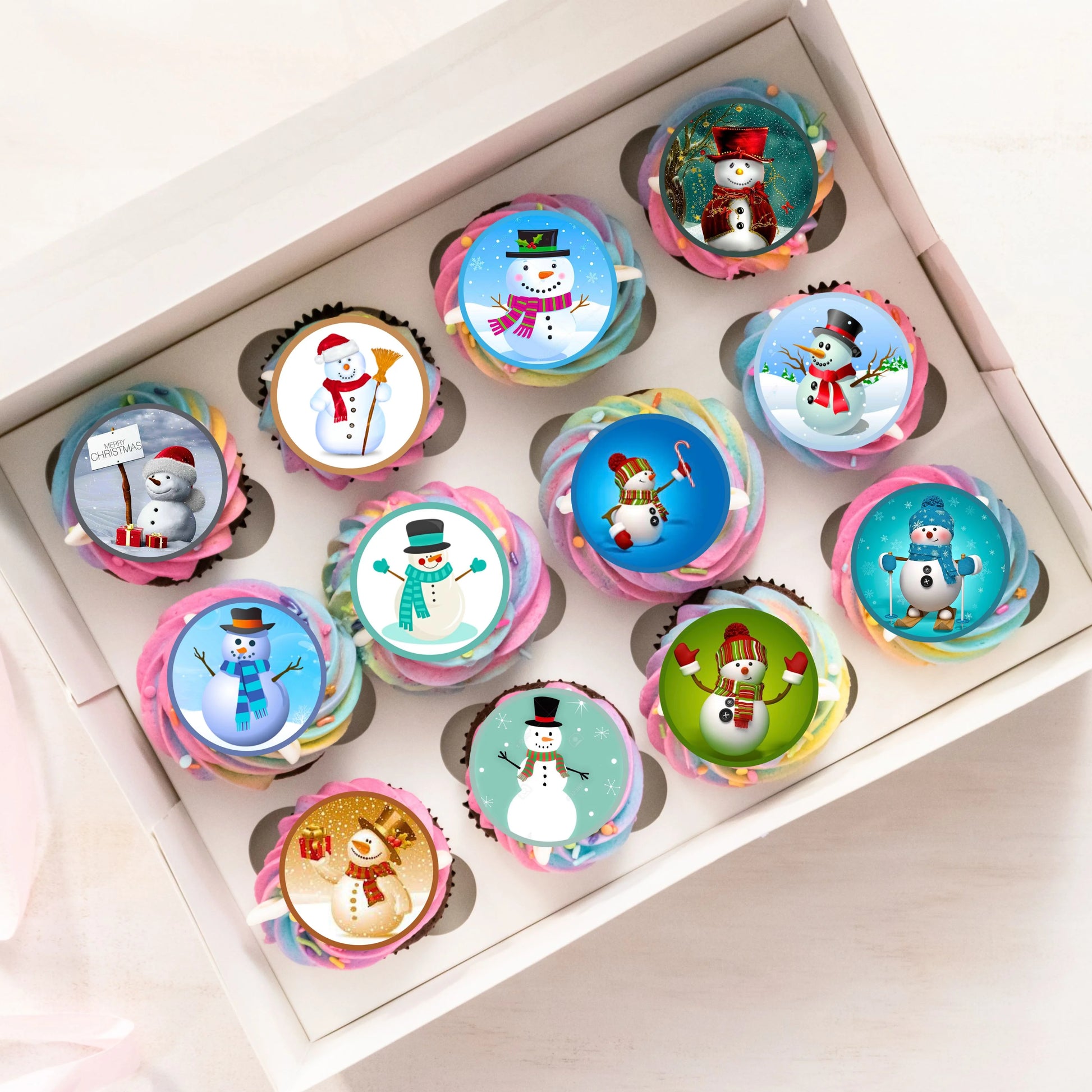 Christmas Snowman Edible Cupcake Toppers on cupcakes with rainbow frosting