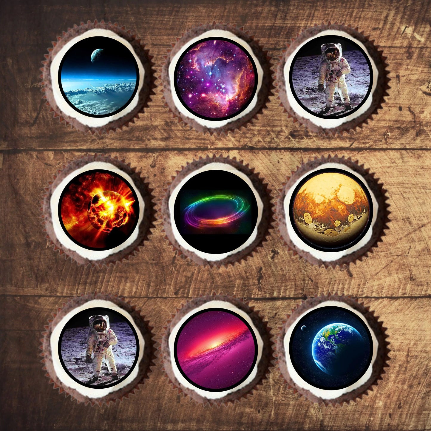 Space Edible Cupcake Toppers on chocolate cupcakes with white frosting