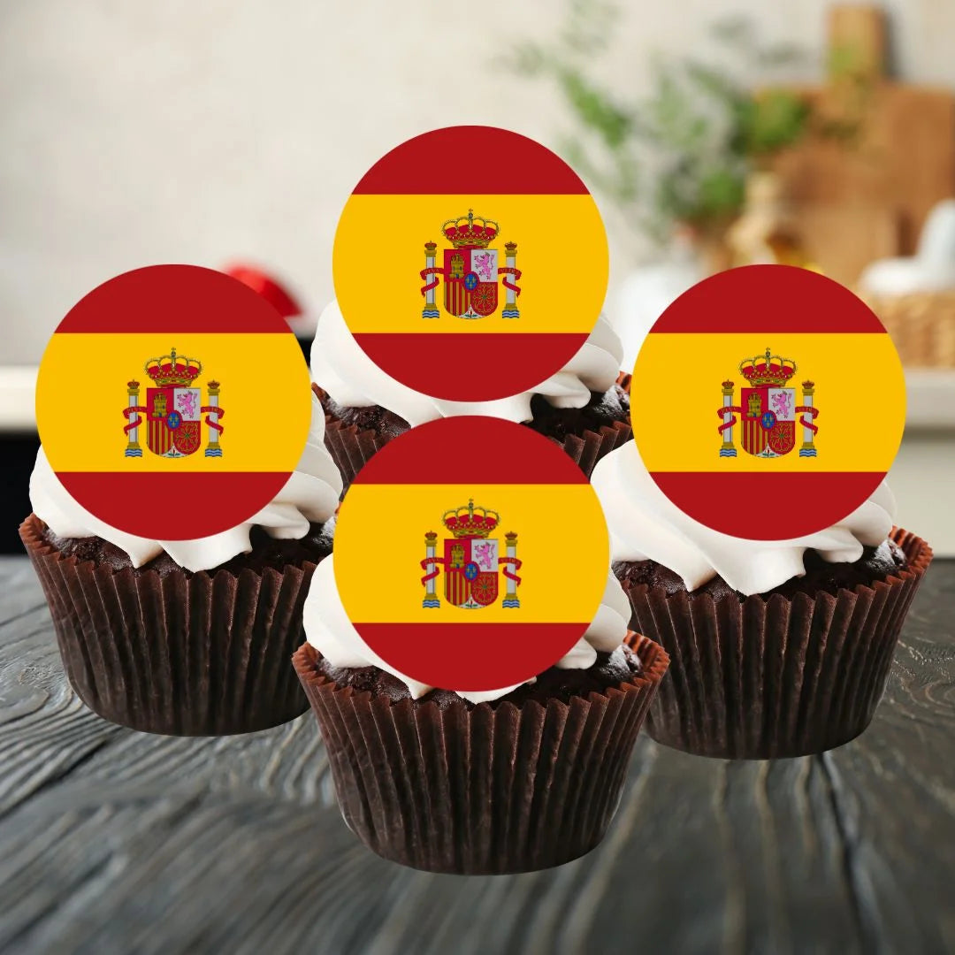 Spanish flag round edible cupcake toppers on chocolate cupcakes with white frosting