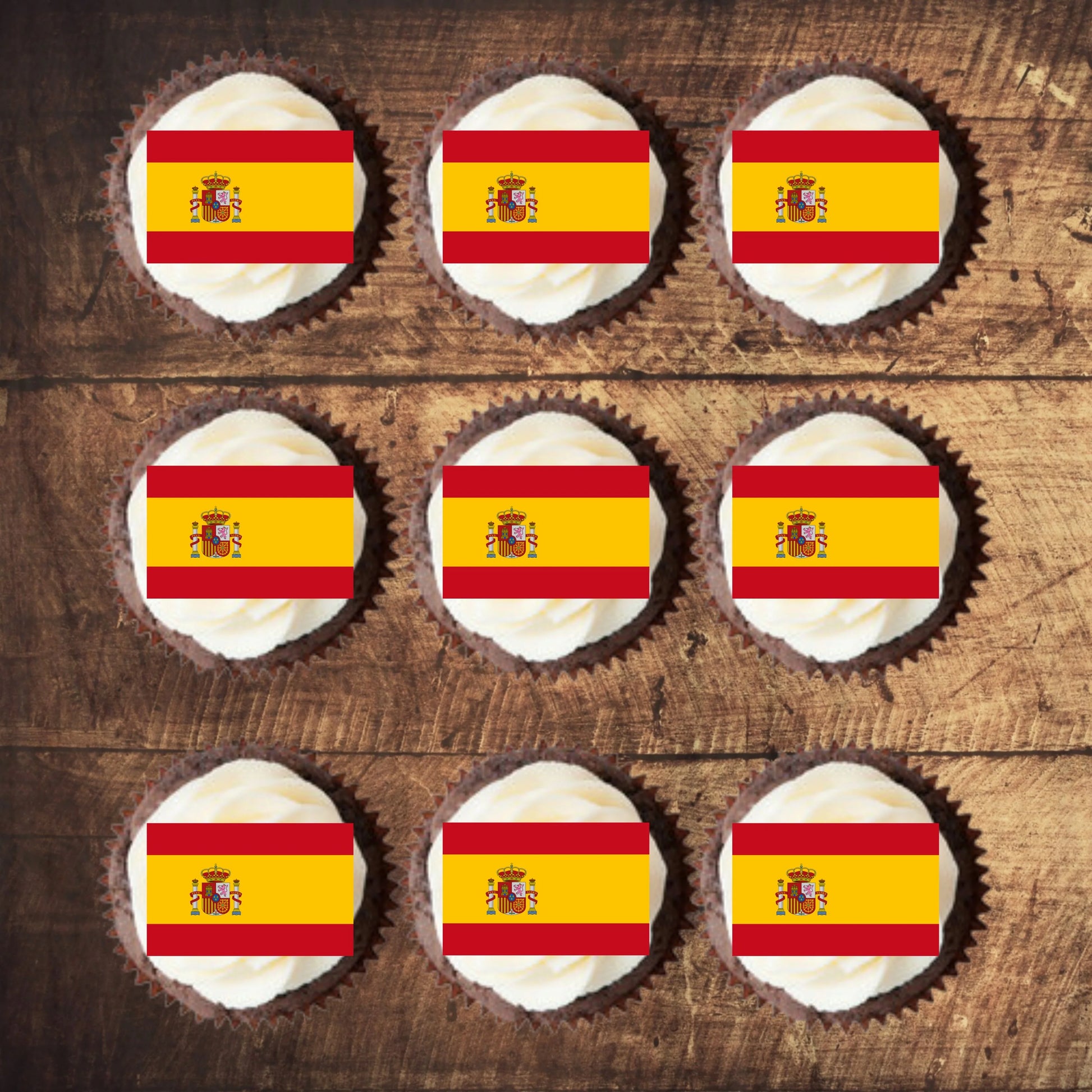 Spanish Flag Edible Cupcake Toppers  on chocolate cupcakes with white frosting 