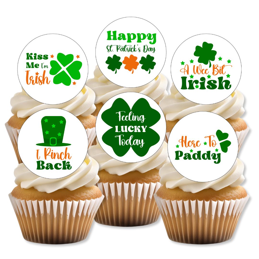 Cupcakes with St. Patrick's Day-themed toppers on a white background