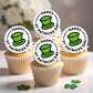 Cupcakes with St. Patrick's Day-themed toppers on a white surface.