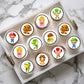 Super Mario Round Edible Cupcake Toppers on white frosted cupcakes 