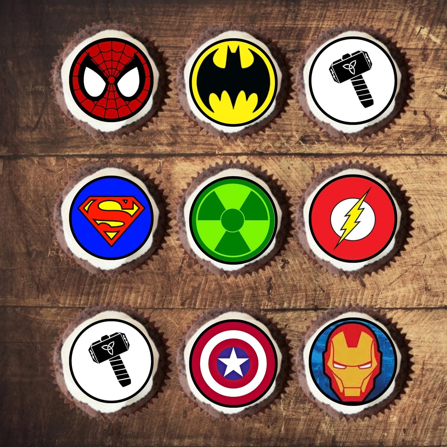 Superhero Theme Edible Cupcake Toppers on chocolate cupcakes with white frosting