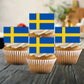 Sweden Flag Edible Cupcake Toppers on white frosted cupcakes