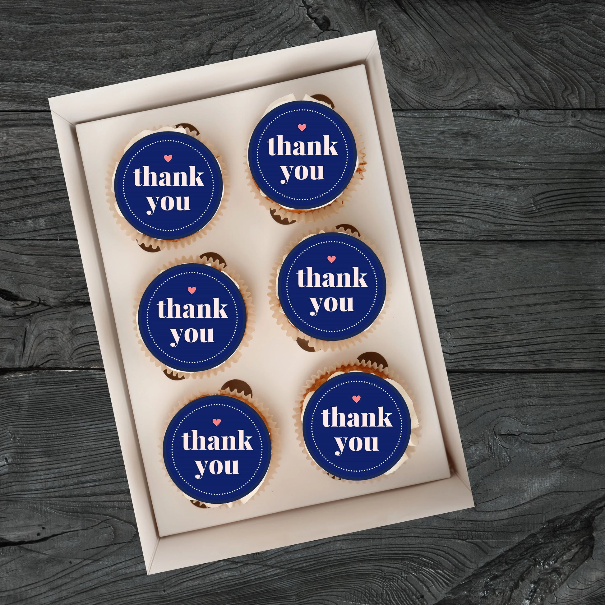 Thank You Blue Edible Cupcake Toppers on  cupcakes with white frosting 