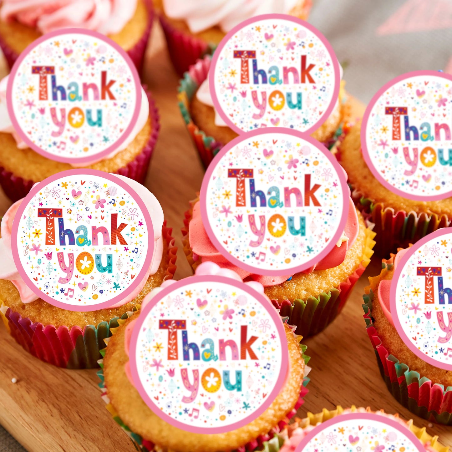 Thank You Pink Cupcake Toppers on white frosted cupcakes 