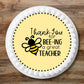 Thank You  for bee-ing a great Teacher Edible Cupcake Topper with a cute bee design on a white frosted cake