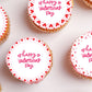 valentines day cookie decorating supplies shown flat on top of frosted cupcakes