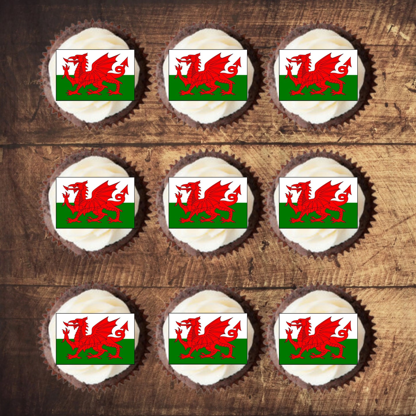 Welsh Flag Edible Cupcake Toppers on white frosted cupcakes on nine frosted cupcakes