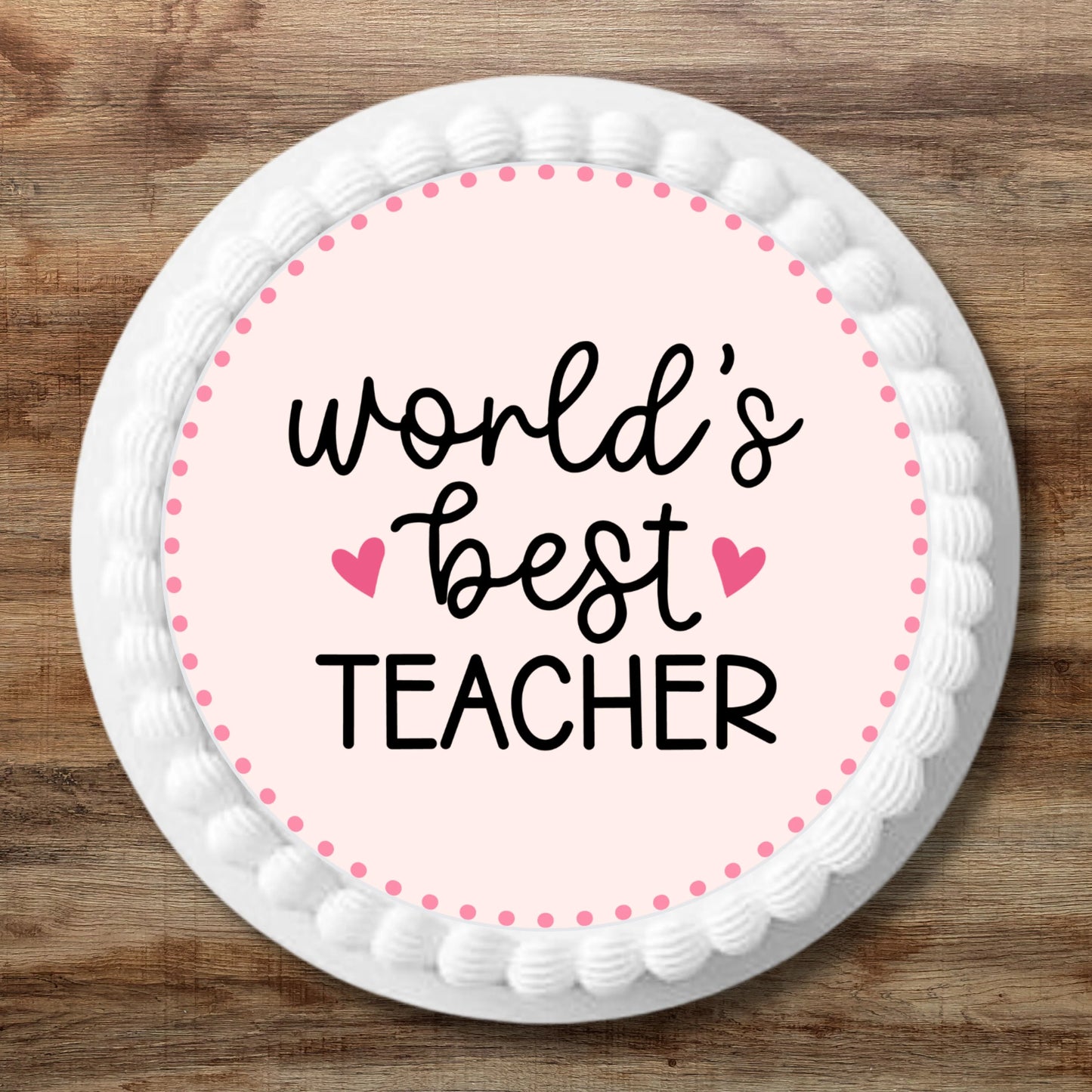 large Worlds Best Teacher cake Topper on a white iced cake