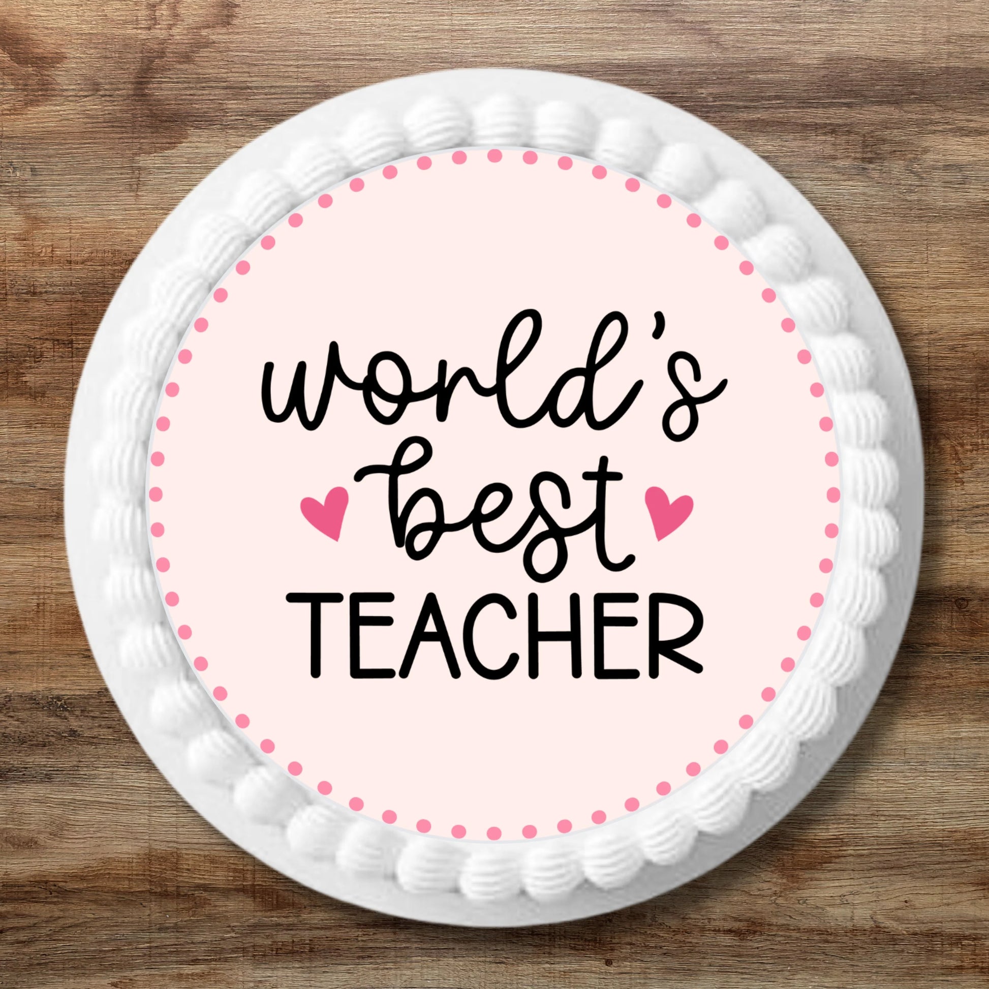 large Worlds Best Teacher cake Topper on a white iced cake